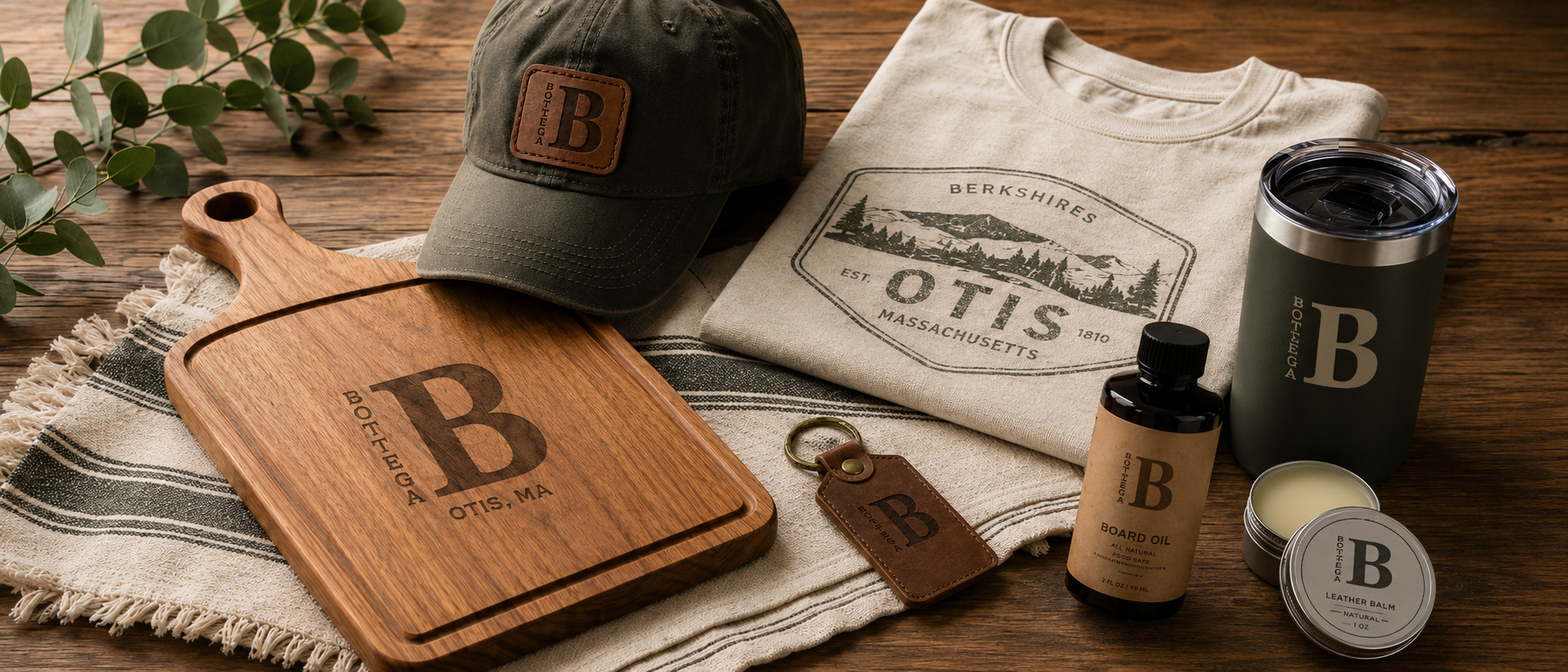 Custom engraved cutting board, local apparel, hat, tumbler, leather keychain, and board care products from Bottega B